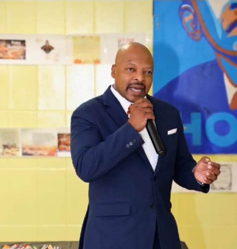 Martin Smallhorne speaking to an audience with a microphone